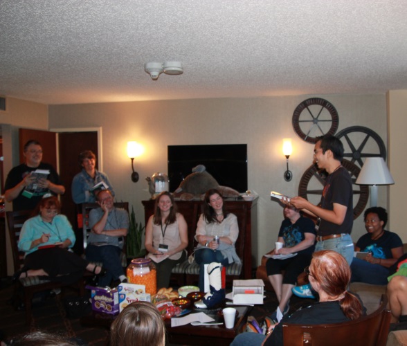 Space Squid fanzine 10th anniversary at the Consuite of ArmadilloCon 2015. D. Chang is leading a game of questions with multiple choice answers -- such as 'Hard science fiction novel plot that was based on a Wikipedia error'.