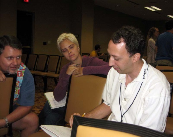Jayme Lynn Blaschke (left) leads students Allyson and Jason through a writing game at the ArmadilloCon 2011 writers' workshop